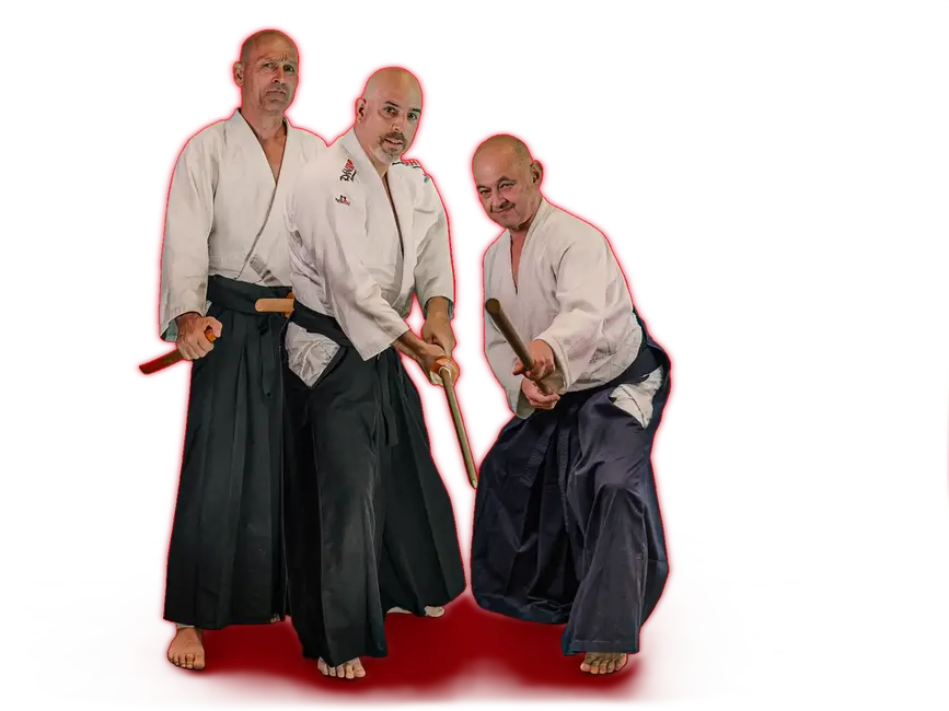 Zwei Männer in traditioneller Aikido-Kleidung üben eine Kampfkunsttechnik als Teil des Turngemeinde Landshut Vereins.