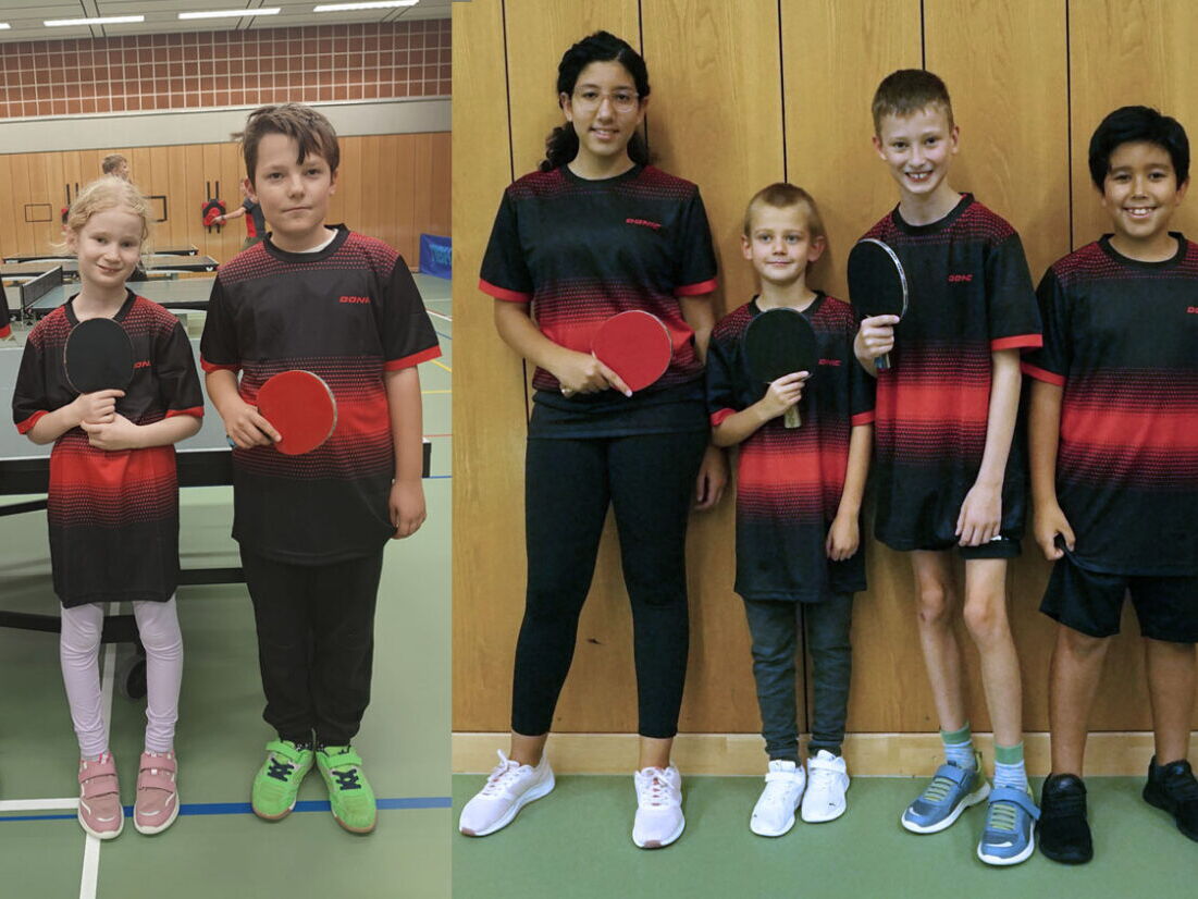 Eine Gruppe junger Tischtennisspieler der Turngemeinde Landshut posiert mit Schlägern in einer Sporthalle.